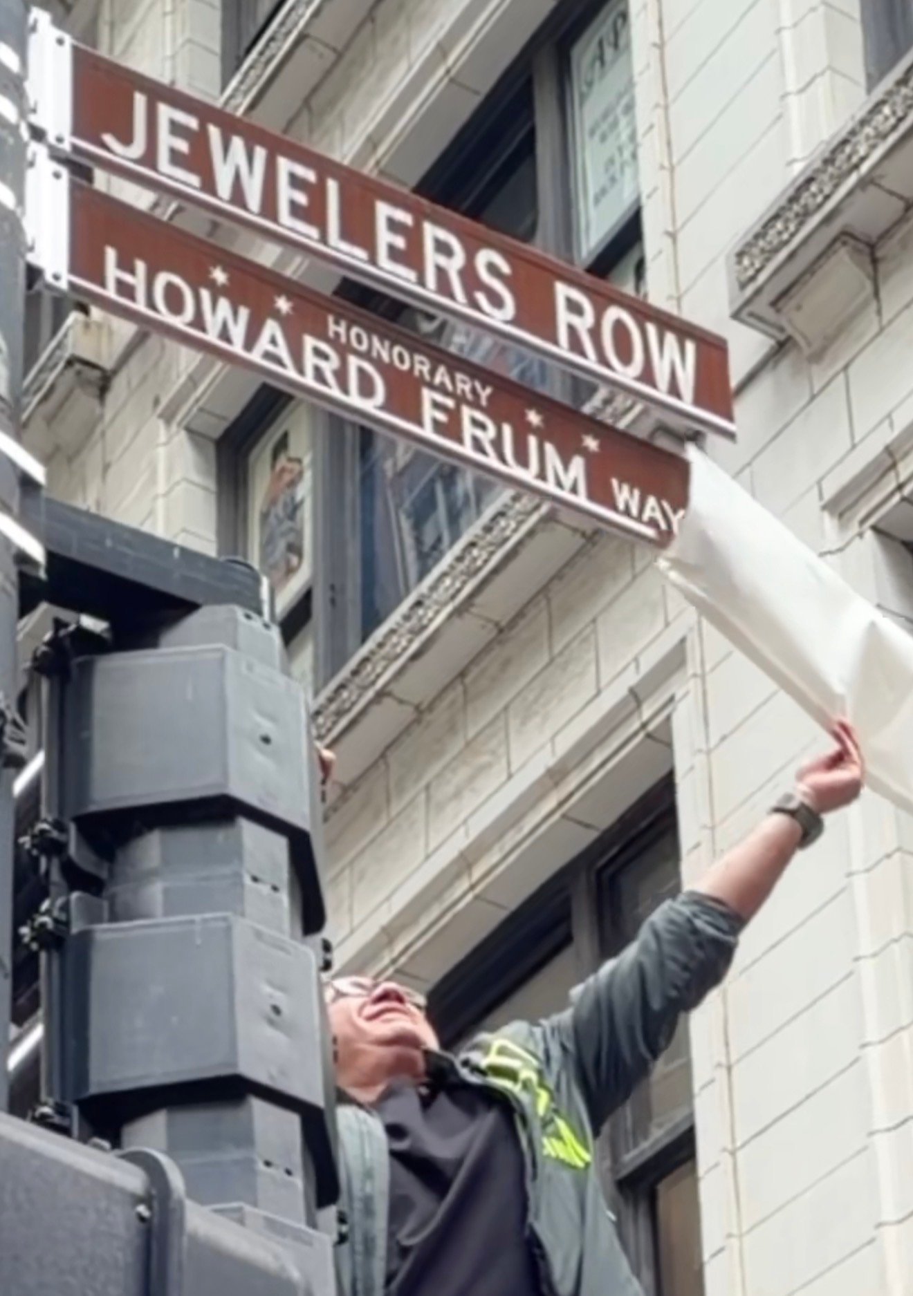 Howard Frum Way street sign being revealed at the dedication
